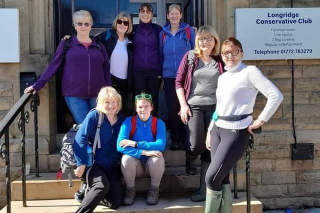 A long way to go for a drink but all in a good cause, Joy (back row, far right) and Margaret (front row, second from the right) with some of those who joined them on their annual charity 10 mile, 10 pub walk this year