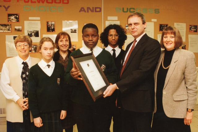 Children have proved they're streetwise in a competition to promote drugs awareness. A University Challenge-style competition ended with Fulwood High School the victors, narrowly beating Ashton High School. Pictured: Les Howell, chief executive of Guild Community Healthcare Trust, hands over the award to Fulwood High pupils Shaun Ross, 14, and team mates Gavin Moorghen (centre) and Jessica Blake (second left). Looking on are Jean Tate (left), head teacher Joy Byrom (third left) and drugs co-ordinator Margaret Tootle