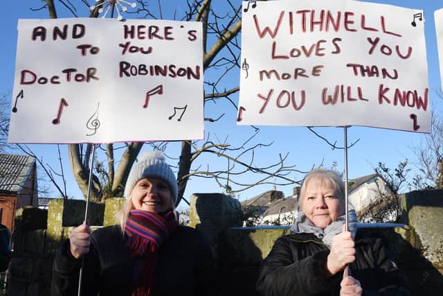 Placard-waving Carolyn Sherman (left) and Jane Mosley - just two of the protestors who staged a demonstration at Withnell Health Centre over its future
