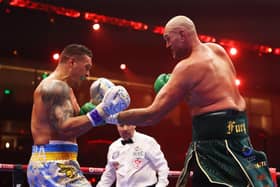 Tyson Fury punches Oleksandr Usyk during their undisputed heavyweight title fight  (Photo by Richard Pelham/Getty Images)