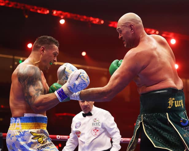 Tyson Fury punches Oleksandr Usyk during their undisputed heavyweight title fight  (Photo by Richard Pelham/Getty Images)