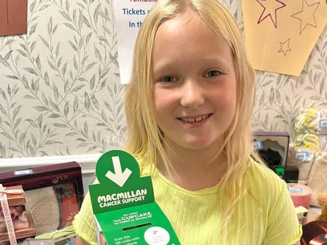 Elsie, a pupil at Chorley New Road Primary Academy helping to fundraise for Macmillan Cancer Support. Photo:  St Catherines Care Home