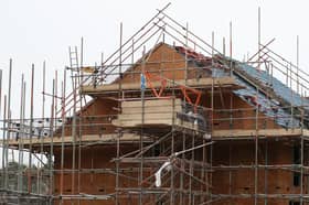 Houses under construction on a housing development. PIC: Andrew Matthews/PA Wire