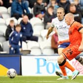 Preston North End's Brad Potts vies for possession with Millwall's Casper de Norre
