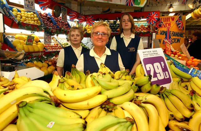 Ellen Young, centre, of Matthew Wade banana stall, Preston market, with collegues Anne Stewart and Rachael Harrison