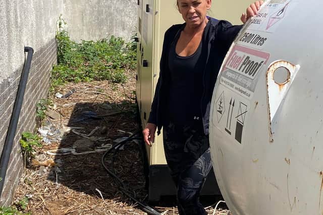 Gaynor Duckworth, 52, who runs Smart Fit Gym and Hyrox on Park Hall Road, pictured with a generator she has to use for her premises after the electricity was cutt off