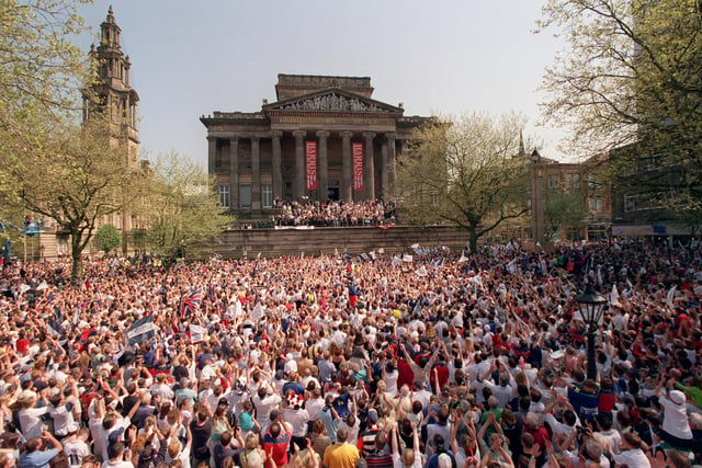 A vast crowd of fans celebrate on the Flag Market during the Preston North End Championship parade in Preston in 2000