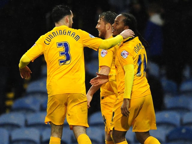 Preston North End's Daniel Johnson, right, celebrates scoring his side's second goal with teammates Greg Cunningham, left, and Joe Garner