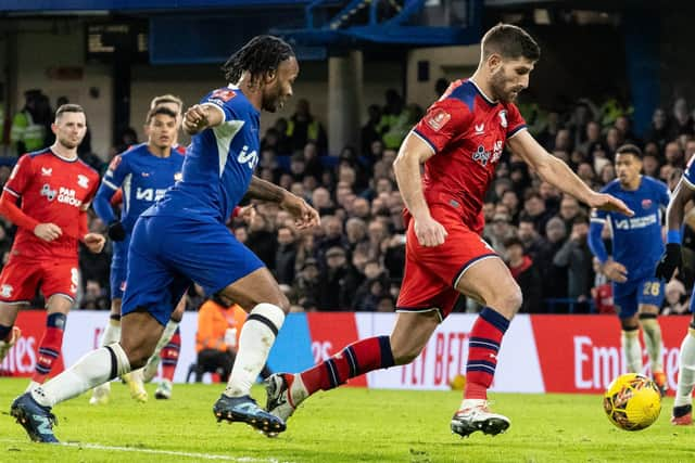 Ched Evans breaks away from Chelsea's Raheem Sterling (photo: Andrew Kearns/CameraSport)