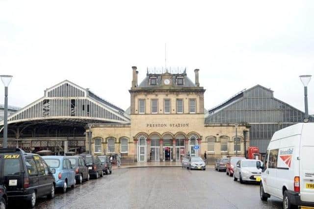 A teenage girl punched a train guard in the face at Preston railway station