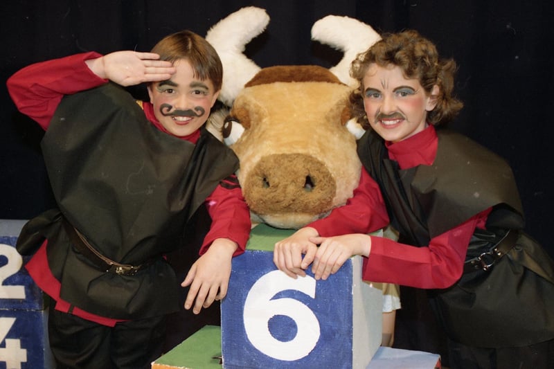 Top class youngsters at Broughton Primary School were bidding their last farewell to the school in spectacular style, by starring in the play The Big Noise at Fort-Issimo. Pictured at the dress rehearsal for the play are Nicholas Fisher, left, and Amanda Edwards, right, with Fenella Fulbucket, the cow. Inside the cow costume are Anna Dewhurst and Andrew Appleyard