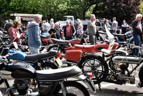 Spectators admiring the motorbikes on show