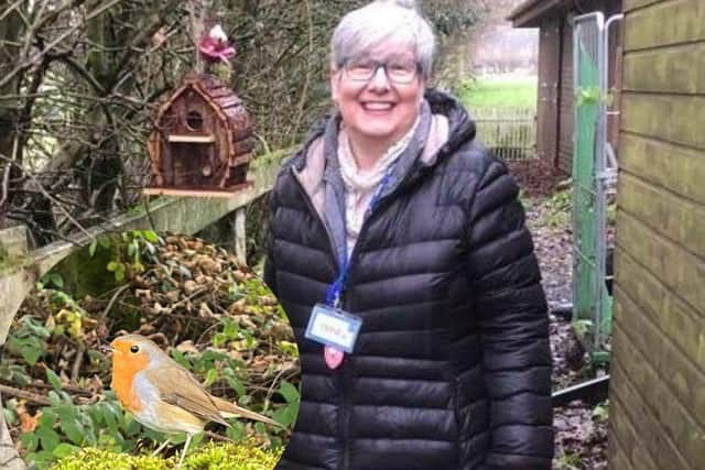 Sales advisor Diane Faunch with a nest box they’ve just put up Mr Robin