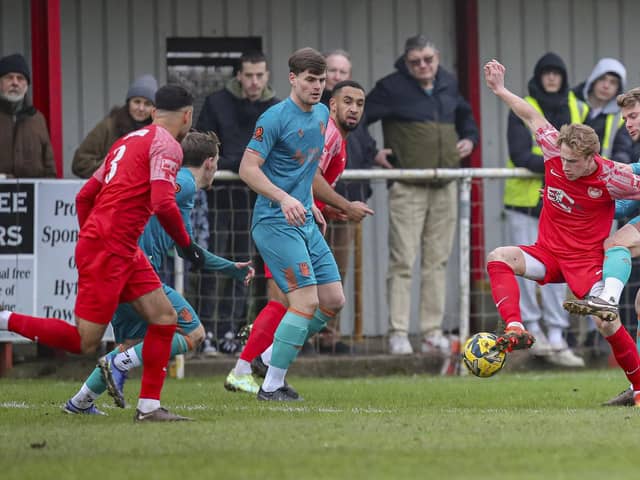 From the left, Jack Hazlehurst, Mike Calveley and Ollie Shenton in the thick of the action during Chorley's FA Trophy win over Hythe Town last weekend (photo: David Airey/dia_Images)