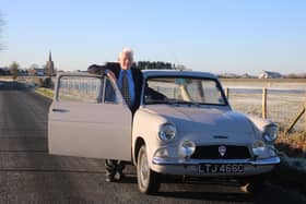 Graham Curwen on Back Sands Lane, Pilling, the road he's travelled since 1965 in this Anglia. Picture by A J G Bell.