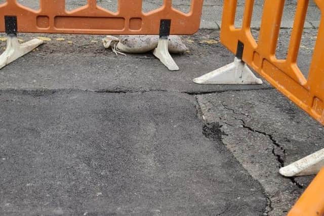 The authorities are not yet sure what damage lies beneath this dip in Mount Street's surface  (image: Mohammed Vaid)