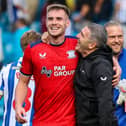 Preston North End manager Ryan Lowe hugs goalscorer Liam Lindsay 