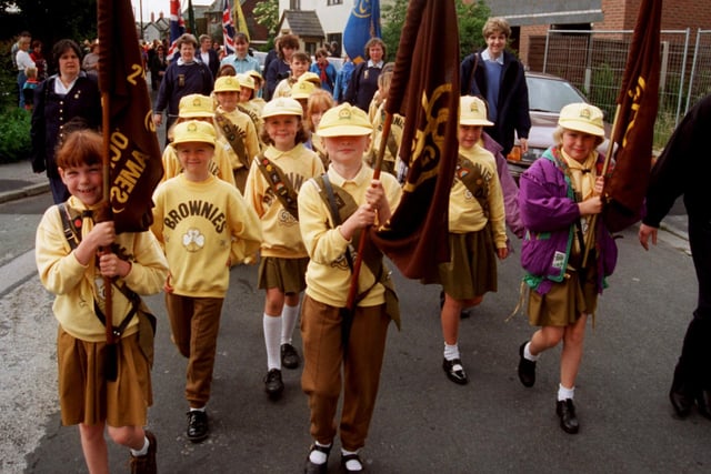The Lostock Hall St. James' Brownies fly the flag during a procession through Lostock Hall, near Preston back in 1996
