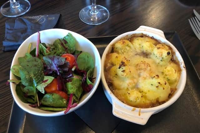 Slow cooked beef pie was topped with garlic and chive mash.