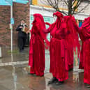 Extinction Rebellion protestors dressed head to foot in red were in Morecambe this weekend to highlight the 'shocking state' of our waterways.