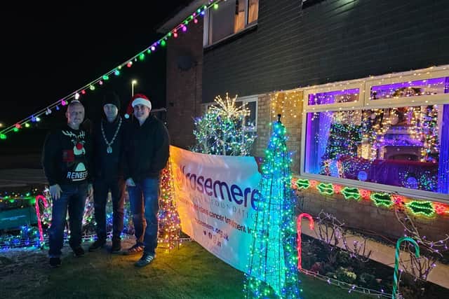 Penwortham Mayor, Coun Ian Watkinson, (centre) lead the countdown to the synchronized switch  on. Photo: Rosemere Cancer Foundation