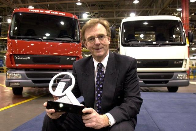 The managing director of Leyland Trucks, Stuart Heyes, with the award for International Truck of the Year 2002