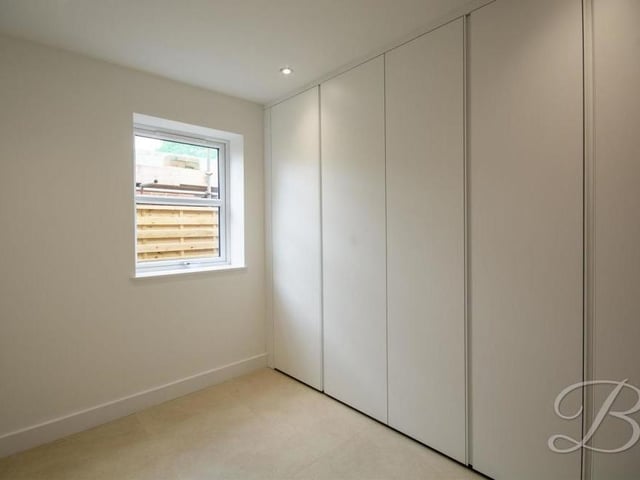 If you need to work from home, this office or study is ideal. It boasts cupboards for storage, a central heating radiator, down lights and a window to the side of the house.