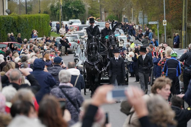 The funeral cortege of Paul O'Grady travels through the village of Aldington, Kent ahead of his funeral at St Rumwold's Church.