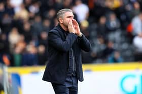 Preston North End manager Ryan Lowe shouts instructions to his team from the technical area