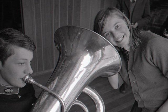 A girl with an ear for good music, Susan Potter, is given a blast on the euphonium by Graham Child, of the band of the Royal Artillery, Woolwich. The band gave a concert at her school, St Cuthbert Mayne, Fulwood, and other venues throughout Preston