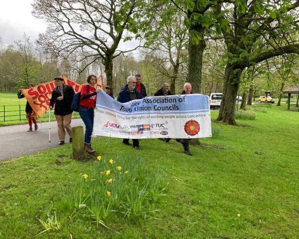 Peter Billington (far right) and colleagues carrying the Lancashire Association of TUCs banner