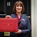 Chancellor of the Exchequer Rachel Reeves poses with the red Budget Box as she leaves 11 Downing Street last autumn; what will she have in store today? (Picture: Justin Tallis/AFP)