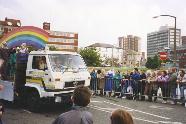 Churches float which is going the wrong way up Corporation Street for Preston Guild. In the background is the now demolished flats on Moor Lane, and also the Adelphi Pub on corner of Adelphi Street/Fylde Street