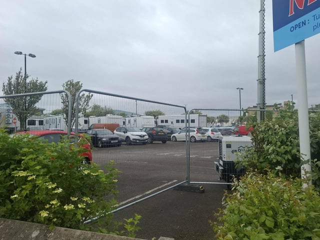 TV crews park their trucks at the Festival Market car park during filming for The Bay.