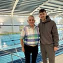 Sam Callaghan with dad Tony after completing his 24 hour swim challenge at Leeds United training facilities