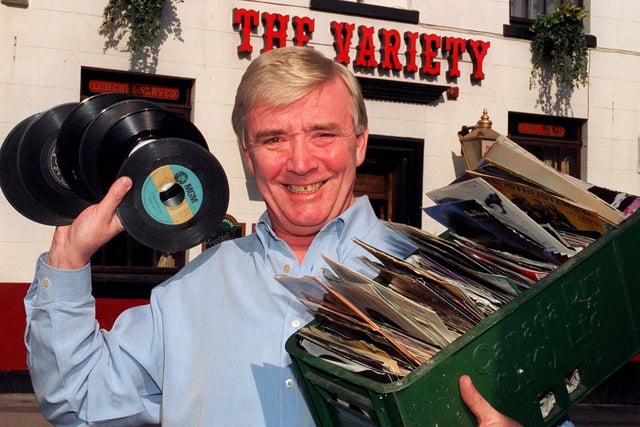 Landlord of The Variety, Adelphi Street, Preston, Terry Hyams, with just a few of the hundreds of singles he is giving to a charity now that the pub has fitted a new CD box