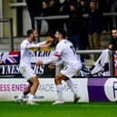 Tyler Roberts opens the scoring and celebrates with Jon Ustabasi (photo: Steve Mclellan)