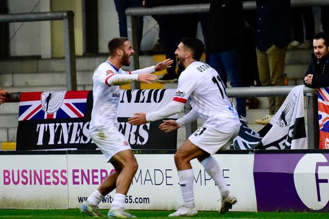 Tyler Roberts opens the scoring and celebrates with Jon Ustabasi (photo: Steve Mclellan)