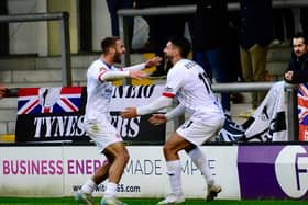 Tyler Roberts opens the scoring and celebrates with Jon Ustabasi (photo: Steve Mclellan)