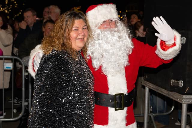 Former EastEnders actress Cheryl Fergison with Father Christmas at Lytham Lights Switch-On 2024