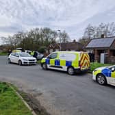 Officers have returned to a house in Wigan where the remains of a baby were found