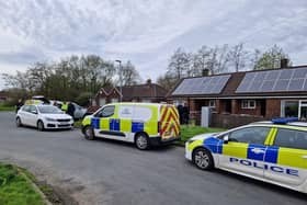 Officers have returned to a house in Wigan where the remains of a baby were found