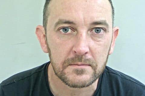 Andrew Waring is also wanted by police in to relation multiple offences (Credit: Lancashire Police)