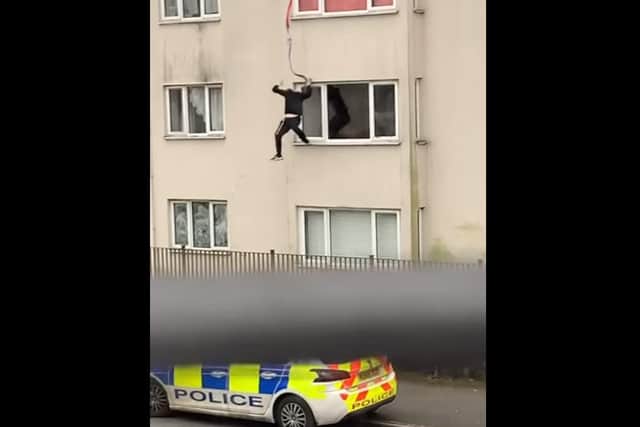 The man, who is reportedly wanted by police, has been dubbed the 'Callon Spider-Man' after he abseiled down a four-storey block of flats on the Callon estate in Preston