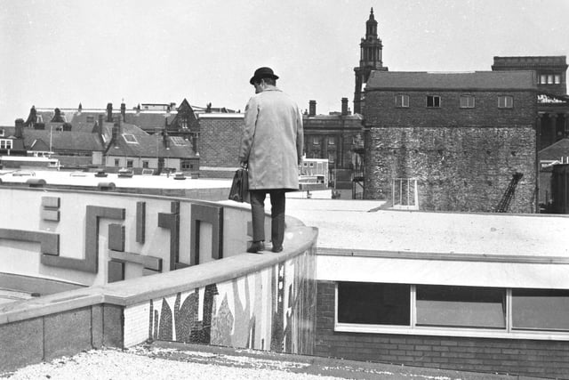 What was the mystery gentleman doing on the roof of St George's Shopping Centre in Preston?
