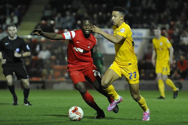 Preston North End's Callum Robinson holds off the challenge from Leyton Orient's Marvin Bartley.