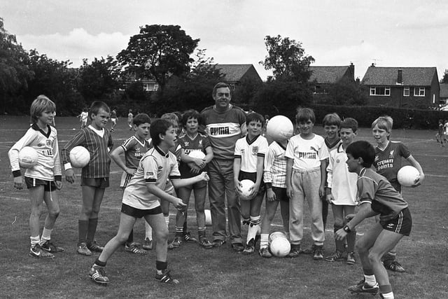 Ninety football-crazy youngsters have kicked off the new soccer season with top TV personality Ian St John. The budding Bests and mini Maradonas are learning the basic facts of football at the former Liverpool star's soccer school at Fulwood Leisure Centre
