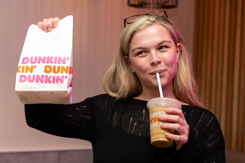 Reporter Hannah Bridgeman ready to try out drinks and donuts at the opening of Dunkin Donuts at the Capitol Centre, Preston. Photo: Kelvin Stuttard