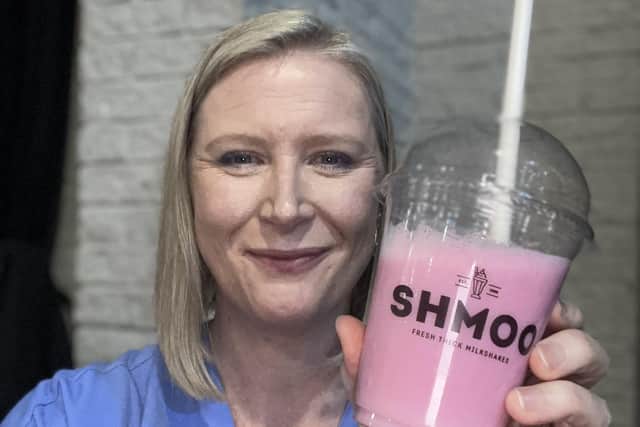 Marketing manager Jill Clark with one of the delicious tasting strawberry shakes