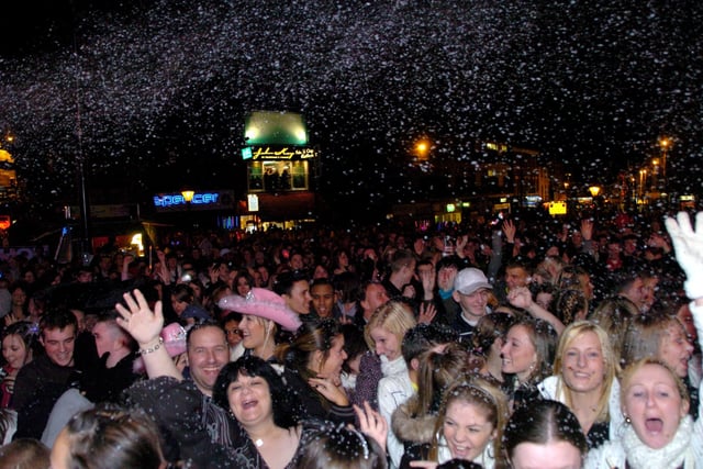 Happy faces as snow fell on Preston's Flag Market as the Christmas lights were switched on